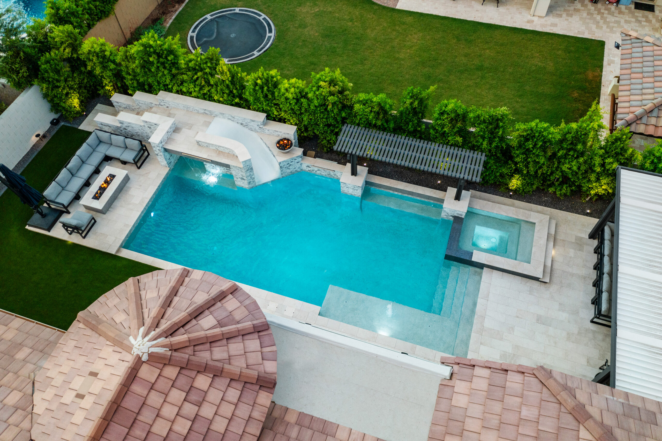 a pool with a pool and a trampoline