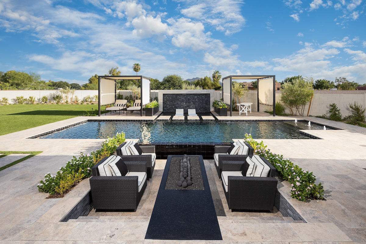 a pool with chairs and a table